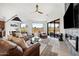 Spacious living room featuring leather furniture and a fireplace at 16328 E Ridgeline Dr, Fountain Hills, AZ 85268