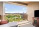 Relaxing patio with stunning mountain views and a TV at 16328 E Ridgeline Dr, Fountain Hills, AZ 85268