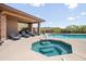 Relaxing community pool and spa with lounge chairs at 16328 E Ridgeline Dr, Fountain Hills, AZ 85268