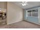 Neutral bedroom with a ceiling fan, window, and doorway to the kitchen at 1638 E Sandra Ter, Phoenix, AZ 85022