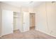 Bright bedroom featuring an open closet, neutral walls, and doorway at 1638 E Sandra Ter, Phoenix, AZ 85022