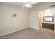 Bedroom with a ceiling fan, air conditioner, and doorway to the bathroom at 1638 E Sandra Ter, Phoenix, AZ 85022