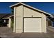 Exterior view of a light beige house with a white garage door at 1638 E Sandra Ter, Phoenix, AZ 85022