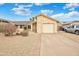 Charming home features desert landscaping, two-car garage, and beautiful facade at 1638 E Sandra Ter, Phoenix, AZ 85022