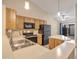 Bright kitchen featuring wood cabinets, a stainless steel sink, and modern black appliances at 1638 E Sandra Ter, Phoenix, AZ 85022