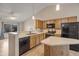 Bright kitchen featuring wood cabinets, and modern black appliances at 1638 E Sandra Ter, Phoenix, AZ 85022