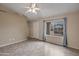 Inviting living room featuring tile floors, a ceiling fan, and natural light through the window at 1638 E Sandra Ter, Phoenix, AZ 85022