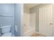 Bright bathroom with a tub, toilet and linen closet at 1645 W Baseline Rd # 2075, Mesa, AZ 85202