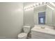 Clean bathroom with white vanity and updated lighting at 1645 W Baseline Rd # 2075, Mesa, AZ 85202