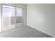 Bedroom with sliding door to balcony and grey carpet at 1645 W Baseline Rd # 2075, Mesa, AZ 85202