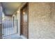 Condo entrance with brown door and metal gate at 1645 W Baseline Rd # 2075, Mesa, AZ 85202