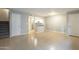 Open living area with tile floors and kitchen access at 1645 W Baseline Rd # 2075, Mesa, AZ 85202