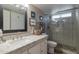 Clean bathroom with granite countertop, white cabinets, and a walk-in shower at 16636 S 34Th Way, Phoenix, AZ 85048