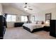 Large bedroom with king bed and ample natural light at 16636 S 34Th Way, Phoenix, AZ 85048