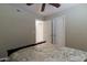 Spacious bedroom with a floral-patterned bed, ceiling fan, and double-door closet at 16636 S 34Th Way, Phoenix, AZ 85048