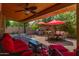 Outdoor patio features a ceiling fan, seating area, and a built-in BBQ grill at 16636 S 34Th Way, Phoenix, AZ 85048