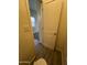 View of a toilet and door leading to another room at 1727 W Pollack St, Phoenix, AZ 85041