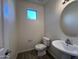 Small bathroom with single sink, toilet and mirror at 1727 W Pollack St, Phoenix, AZ 85041