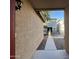 Pathway to home entrance with stucco walls and landscaping at 1727 W Pollack St, Phoenix, AZ 85041