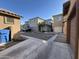 Rear view of a community of two story homes and a driveway at 1727 W Pollack St, Phoenix, AZ 85041