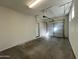 Bright garage featuring an automatic door opener and extra room at 1727 W Pollack St, Phoenix, AZ 85041