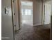 Upstairs hallway with carpet and doors to bedrooms at 1727 W Pollack St, Phoenix, AZ 85041