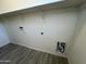 Laundry room with overhead shelving and tile flooring at 1727 W Pollack St, Phoenix, AZ 85041