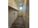 Laundry room with overhead shelving and tile floor at 1727 W Pollack St, Phoenix, AZ 85041