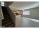 Open living area with stairs, tile floors and kitchen island at 1727 W Pollack St, Phoenix, AZ 85041