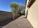 Gravel backyard with small trees and shrubs at 1727 W Pollack St, Phoenix, AZ 85041