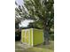 Bright yellow storage shed in the backyard, providing extra storage space at 178 W Harrison St, Chandler, AZ 85225