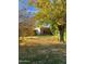 View of home from backyard with autumn leaves and trees at 178 W Harrison St, Chandler, AZ 85225