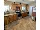 Spacious kitchen featuring granite countertops and ample wood cabinets at 178 W Harrison St, Chandler, AZ 85225