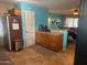 Kitchen with granite countertops and wood cabinets, open to living area at 178 W Harrison St, Chandler, AZ 85225