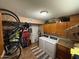 Bright laundry room with washer, dryer, and ample storage at 178 W Harrison St, Chandler, AZ 85225