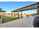 Landscaped backyard with pergola and artificial turf at 18404 W Long Lake Rd, Goodyear, AZ 85338