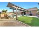 Backyard oasis with pergola, pool and grassy area at 18404 W Long Lake Rd, Goodyear, AZ 85338