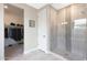 Elegant bathroom featuring a walk-in shower and neutral tile at 18404 W Long Lake Rd, Goodyear, AZ 85338