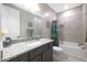 Bathroom with granite countertop and bathtub at 18404 W Long Lake Rd, Goodyear, AZ 85338