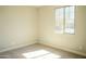 Bedroom with carpet flooring and a window that lets in natural light at 18404 W Long Lake Rd, Goodyear, AZ 85338