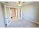 Bedroom boasts a ceiling fan and neutral colors at 18404 W Long Lake Rd, Goodyear, AZ 85338