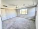 Bedroom with neutral paint, carpet, ceiling fan, and view of backyard at 18404 W Long Lake Rd, Goodyear, AZ 85338