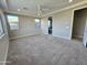 Large bedroom with neutral paint, carpet, ceiling fan, and view of doorway at 18404 W Long Lake Rd, Goodyear, AZ 85338