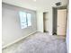 Bedroom with carpet, a window, and closet at 18404 W Long Lake Rd, Goodyear, AZ 85338