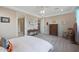 Well-lit bedroom with ensuite bathroom access at 18404 W Long Lake Rd, Goodyear, AZ 85338