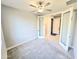 Bedroom features a ceiling fan and an en suite bathroom at 18404 W Long Lake Rd, Goodyear, AZ 85338