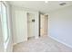 Bedroom features a closet, carpet, and natural light at 18404 W Long Lake Rd, Goodyear, AZ 85338