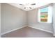 Bright bedroom with ceiling fan and window at 18404 W Long Lake Rd, Goodyear, AZ 85338