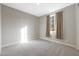 Well-lit bedroom with carpet flooring at 18404 W Long Lake Rd, Goodyear, AZ 85338