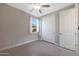 Bright bedroom with double door closet and window at 18404 W Long Lake Rd, Goodyear, AZ 85338